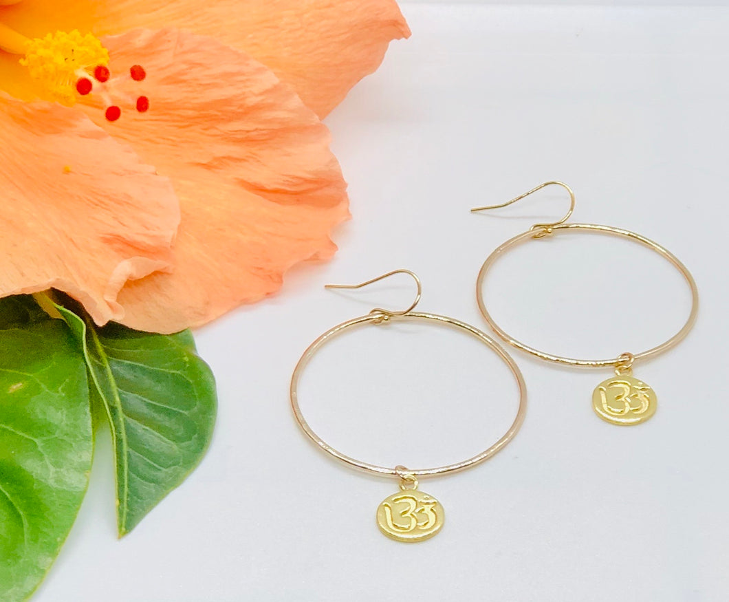Gold hoop earrings with Om charm